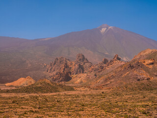 spot in Tenerife with many red rocks and beautiful mountain landscape background