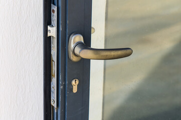 Exploring the Intricate Design of a Modern Door Handle Against a Light Background in a Tranquil Indoor Setting