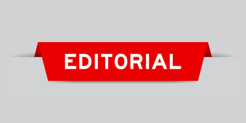Red color inserted label with word editorial on gray background