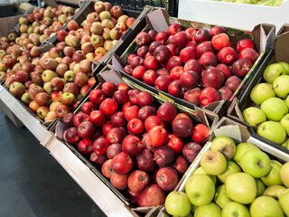 Apples. Shelf with red and green apples fruits in supermarket
