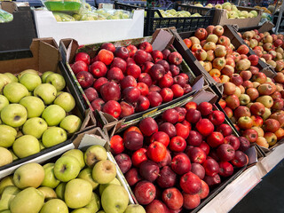 Apples. Shelf with red and green apples fruits in supermarket