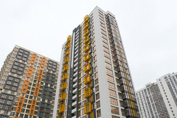 Modern residential buildings with distinctive architecture in an urban landscape on a cloudy day