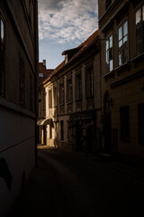 Photo of a city street in the evening