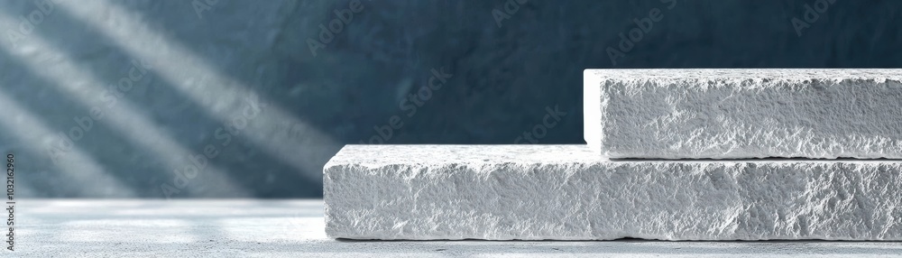 Poster close-up of three textured white blocks stacked on a surface, showcasing minimalistic design and mod
