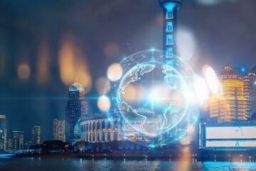 A futuristic digital globe hovers over a cityscape at night.