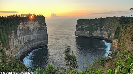 Dramatic sunrise over a narrow strait between two cliffs.