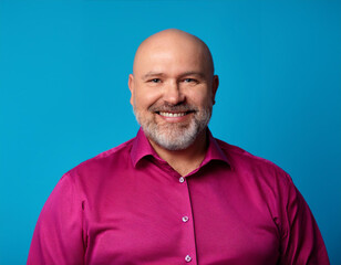 Fototapeta premium Headshot Portrait of a Smiling Mature Man with Contemporary Style, Isolated on Color Background with Ample Copy Space