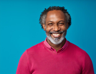 Obraz premium Headshot Portrait of a Smiling Mature Man with Contemporary Style, Isolated on Color Background with Ample Copy Space