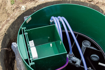 Open septic tank. Septic tank design and internal communications. Pipes and hoses. Autonomous sewage system 