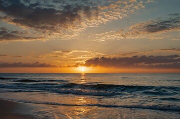 Obraz premium Serene Ocean Sunset with Vibrant Colors - Peaceful Waves and Dramatic Sky