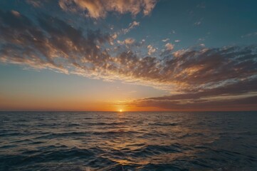 Fototapeta premium Serene Ocean Sunset with Vibrant Colors - Peaceful Waves and Dramatic Sky