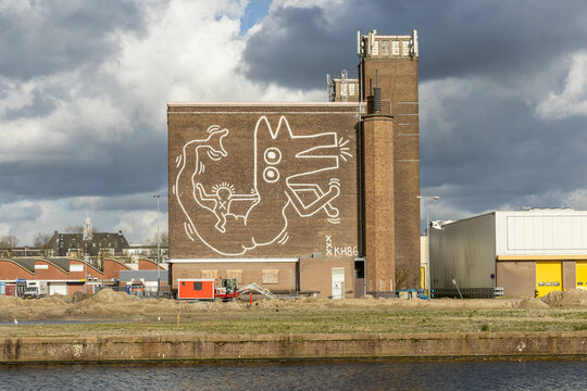 Keith Haring mural from 1986 in Amsterdam was forgotten but still standing. Keith Haring was an American pop art artist. Amsterdam, the Netherlands. 23 March 2024. 