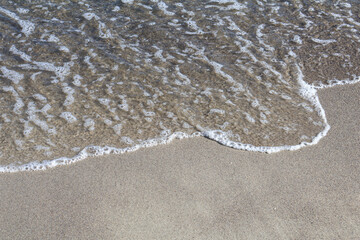 Gentle Wave on a Pristine Sandy Beach