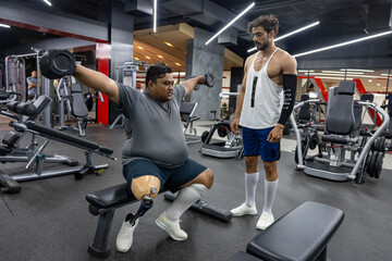 Asian man with prosthetic leg from amputation from diabetes doing weight training workout exercise...