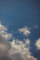 White heap clouds in the blue peaceful sky. The concept of psychological calmness and health. Peace of mind with the forces of nature. Air travel concept.