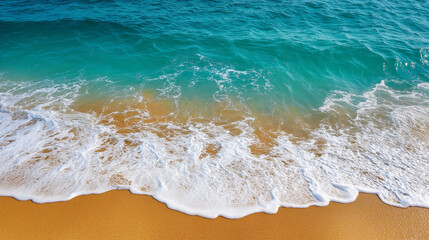 Top view of a tropical sea beach with waves, ideal for summer and seascape photography.