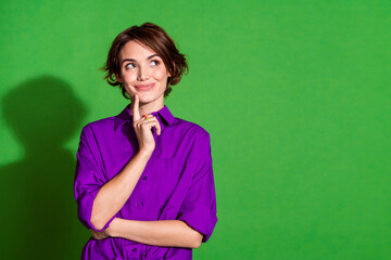 Photo of brown bob haired hipster girl in purple shirt deep thinking touch chin looking novelty...