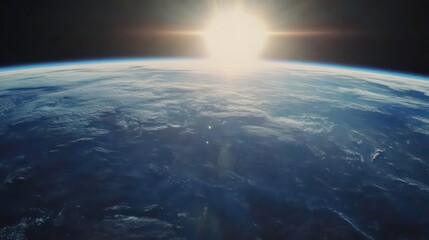 Fototapeta premium A stunning view of Earth from space, with the sun shining brightly in the distance.