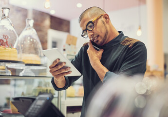 Businessman, waiter and multitasking with phone call or tablet for order, online enquiry or purchase at coffee shop. Man, employee or barista with mobile smartphone or technology for service at cafe