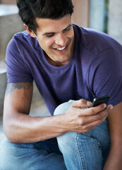 Happy man, typing and social media with phone for communication, chatting or texting at home. Young, male person or user with smile on mobile smartphone for online browsing, app or news at house