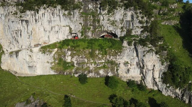 Famous mountain guesthouse Aescher at Ebenalp in the middle of the hiking trail of the Swiss alps