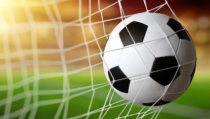 Soccer ball in goal on stadium