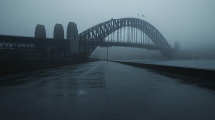 Obraz premium Misty Morning at Iconic Bridge in Fog