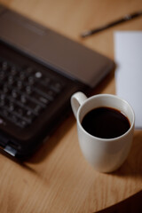 Writer's high: laptop, blank page and aromatic coffee. Coffee creative: ideas on a blank sheet with a coffee drink. Business in every shade: professional elegance in every frame.