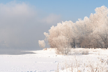 Winter frosty evaporation from the river in cold weather.