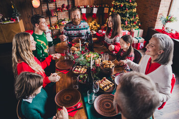 Portrait of friendly peaceful family hold arms pray table gather celebrate new year xmas eve flat indoors