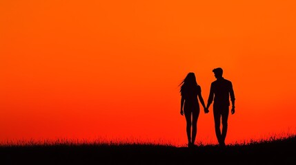 Fototapeta premium Silhouette of a couple holding hands against a vibrant orange sunset, symbolizing love and connection.