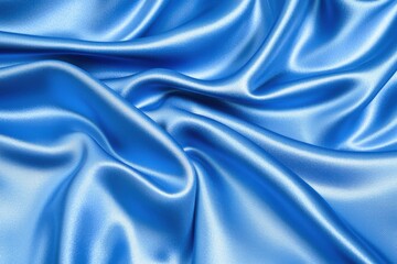 Obraz premium A close-up of smooth, blue satin fabric showcasing its lustrous texture and elegant draping.