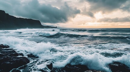 Fototapeta premium Dramatic Stormy Seascape with Crashing Waves and Moody Clouds at Sunset
