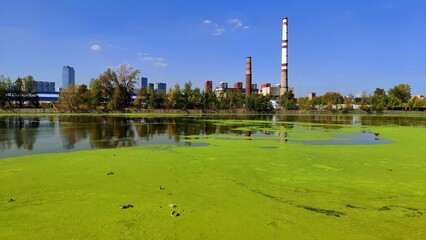 Industrial Landscape. River and Factory Chimney on Background