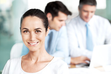 Meeting, office and portrait of woman with confidence, smile or collaboration at finance agency. Teamwork, happy consultant or business people in conference room for workshop, opportunity or planning