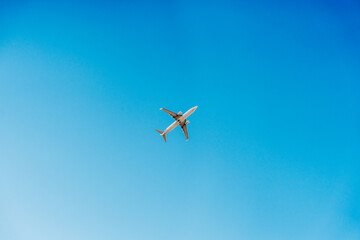Plane flying in clear blue sky