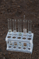Soil analysis in a test tube. Selective focus.