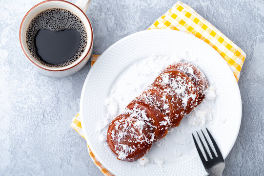Pinoy puto kutsinta, is a type of steamed rice cake popular as street snack or merienda. It is made from a blend of rice or tapioca flour, brown sugar, and lye, giving it its distinct chewy texture.