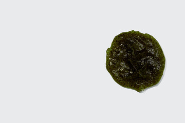 Smears of body scrub on white background. Fruit and berry body scrub texture of the swatch. Cosmetic smear