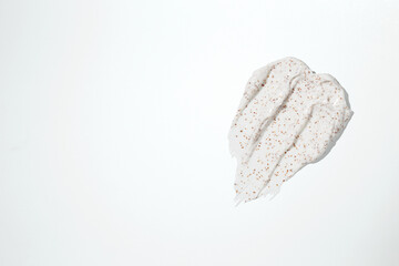 Smears of body scrub on white background. Fruit and berry body scrub texture of the swatch. Cosmetic smear
