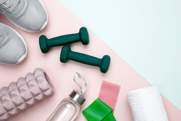 Healthy lifestyle, athlete's equipment set dumbbells, resistance band, foam roller for Myofascial release