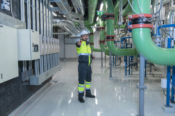 Engineer work in Industrial  chiller  HVAC heating ventilation air conditioning system and pipping...