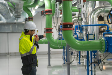 Engineer work in Industrial  chiller  HVAC heating ventilation air conditioning system and pipping...