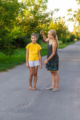 Child spraying mosquito repellent. Selective focus.