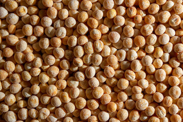 Uncooked Yellow Polished Peas Background. A Culinary Canvas of Dry Yellow Peas, Creating a Lively and Textured Background for Gourmet Cooking. Scattered Raw Polished Peas. Healthy Eating Ingredients