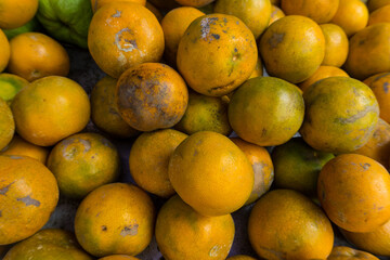 a pile of oranges in the traditional market.