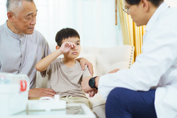 Grandfather taking his grandson to see doctor in hospital.