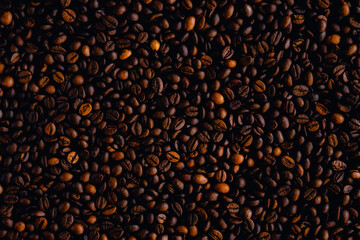 The background photo shows high-quality, naturally aromatic roasted coffee beans, which will be ground to make a delicious cup of coffee.