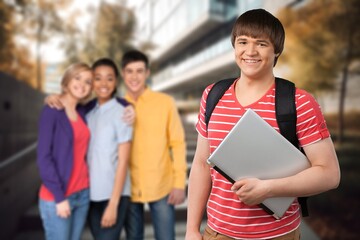 Young student at university building background