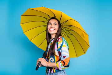 Photo of toothy beaming nice woman wear print shirt jeans holding umbrella look at offer empty...